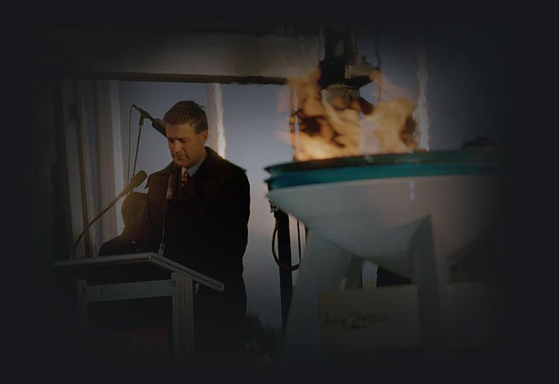 Deputy Prime Minister John Anderson beside the Olympic flame, 5 September 2000.