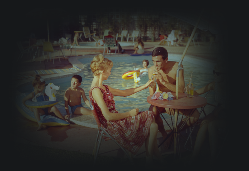 Guests dining by the motel pool. 