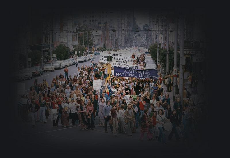 Women marching on a street in Melbourne.