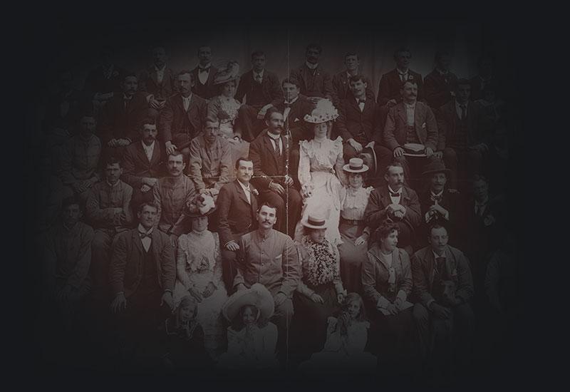 Group photograph of Wirth's Circus troupe with children and dogs.