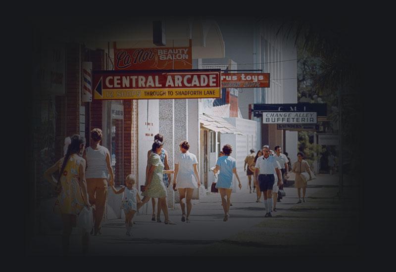 People walk on a footpath adjacent to Central Arcade.