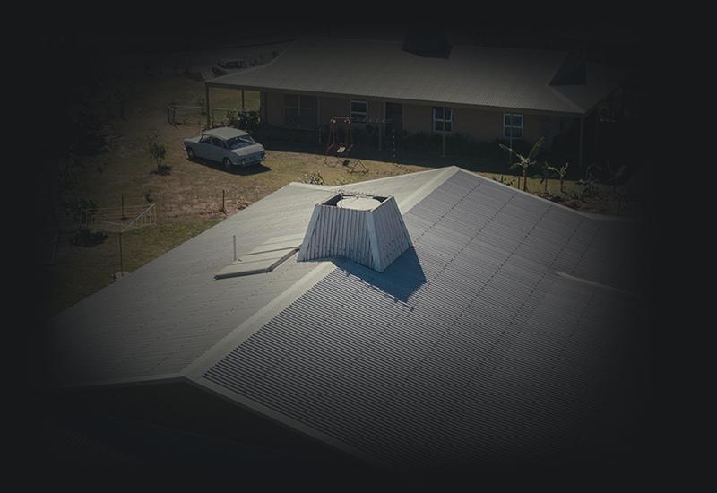 Houses with corrugtaed steel roofing.