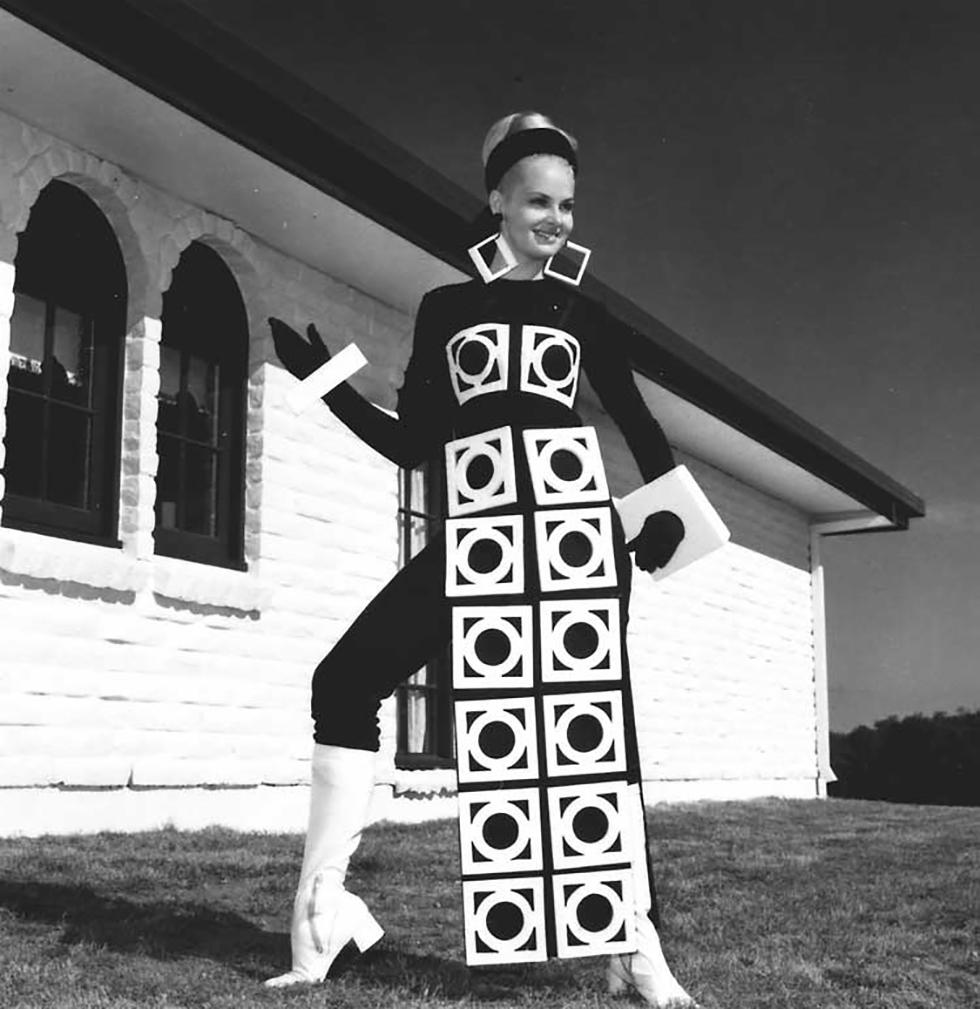 Photograph of a woman wearing an outfit of circles within squares