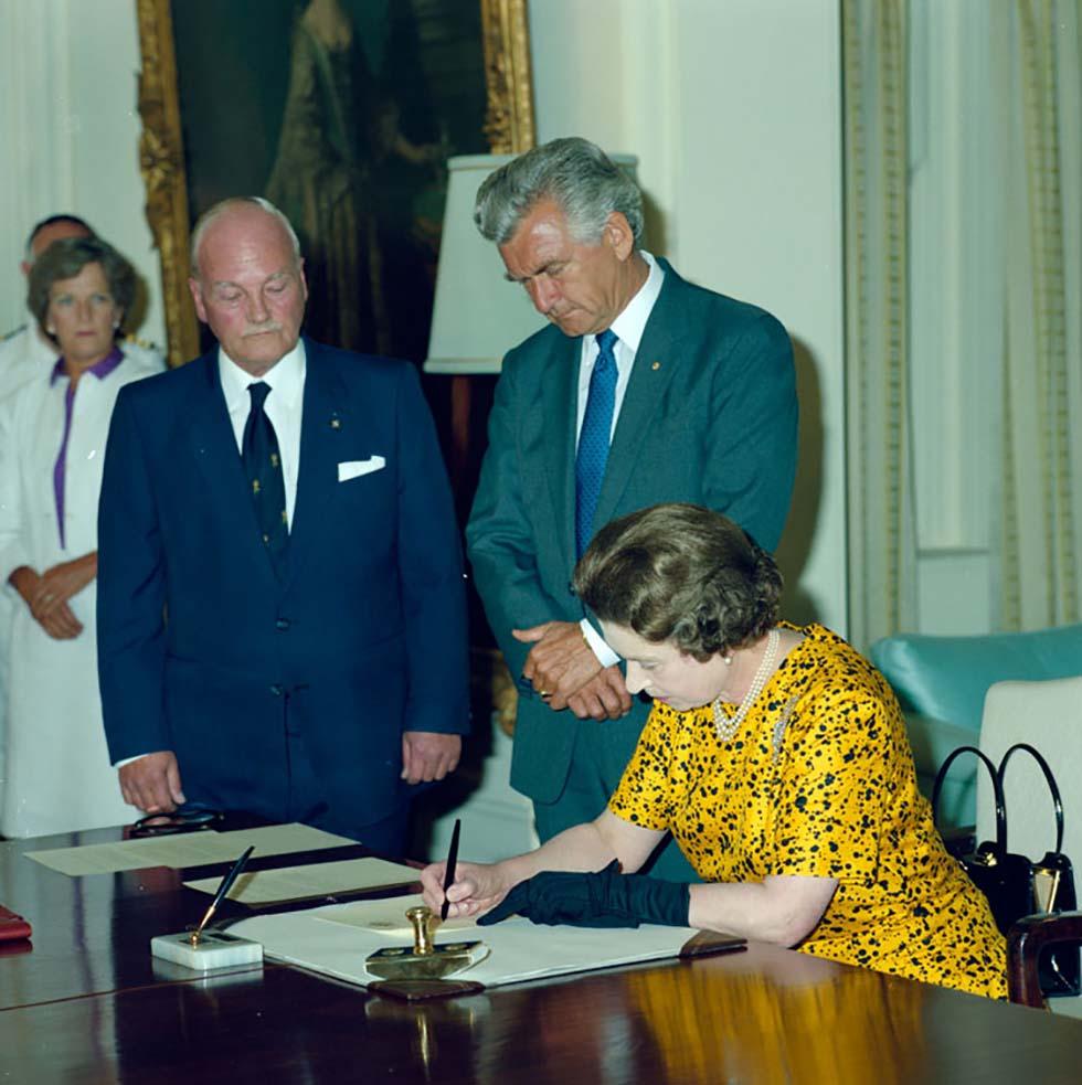 Queen Elizabeth II signs the Proclamation of the Australia Act (Cth)