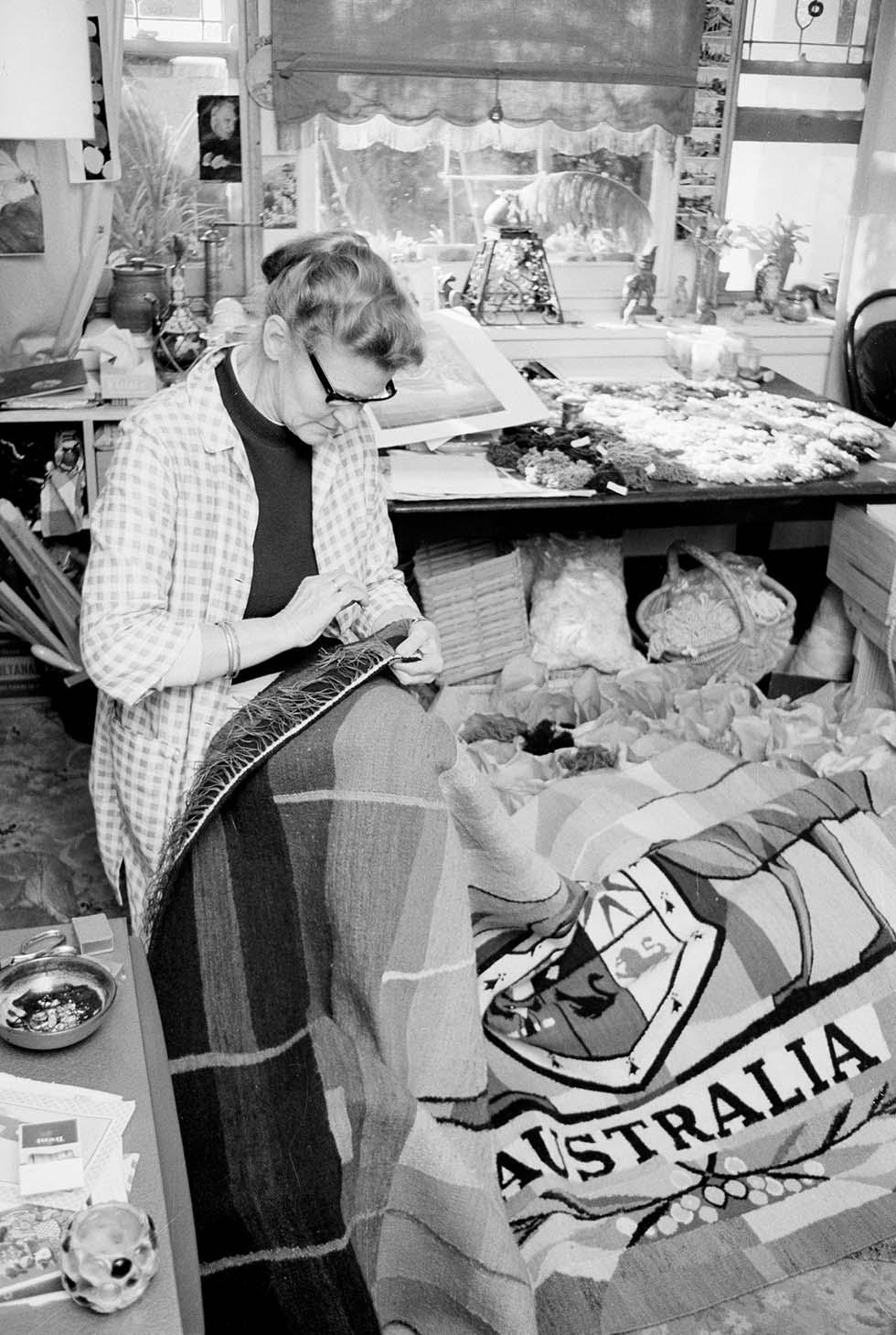 German woman weaves Coat of Arms for Expo 70