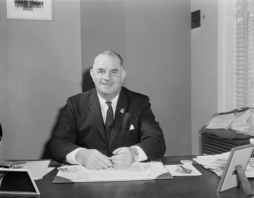 Hubert Opperman, Minister for Immigration, in his office