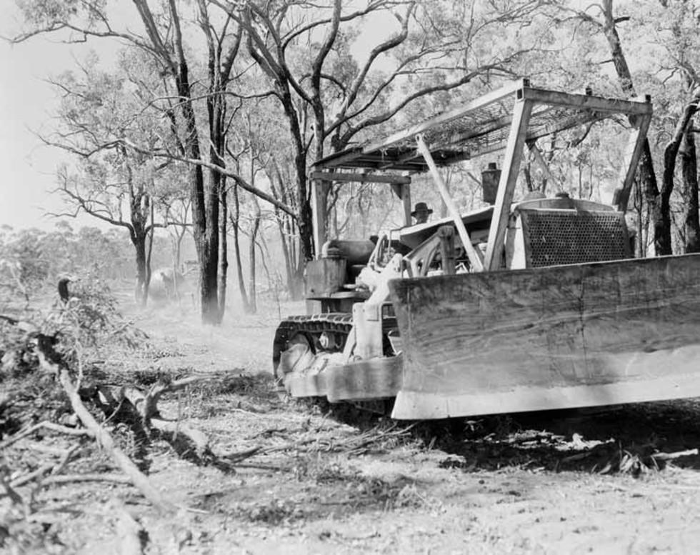 Bulldozer clearing land for a new town in Western Australia.