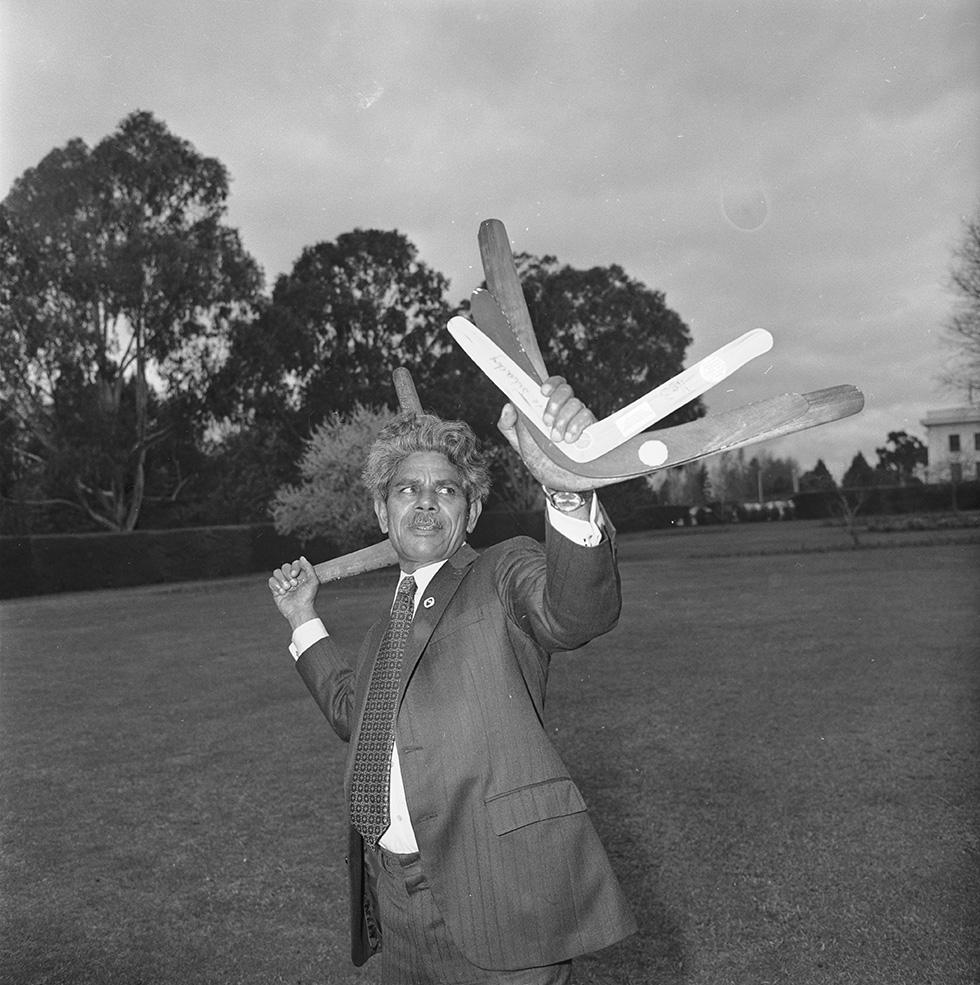 Senator Neville Bonner throwing a boomerang.