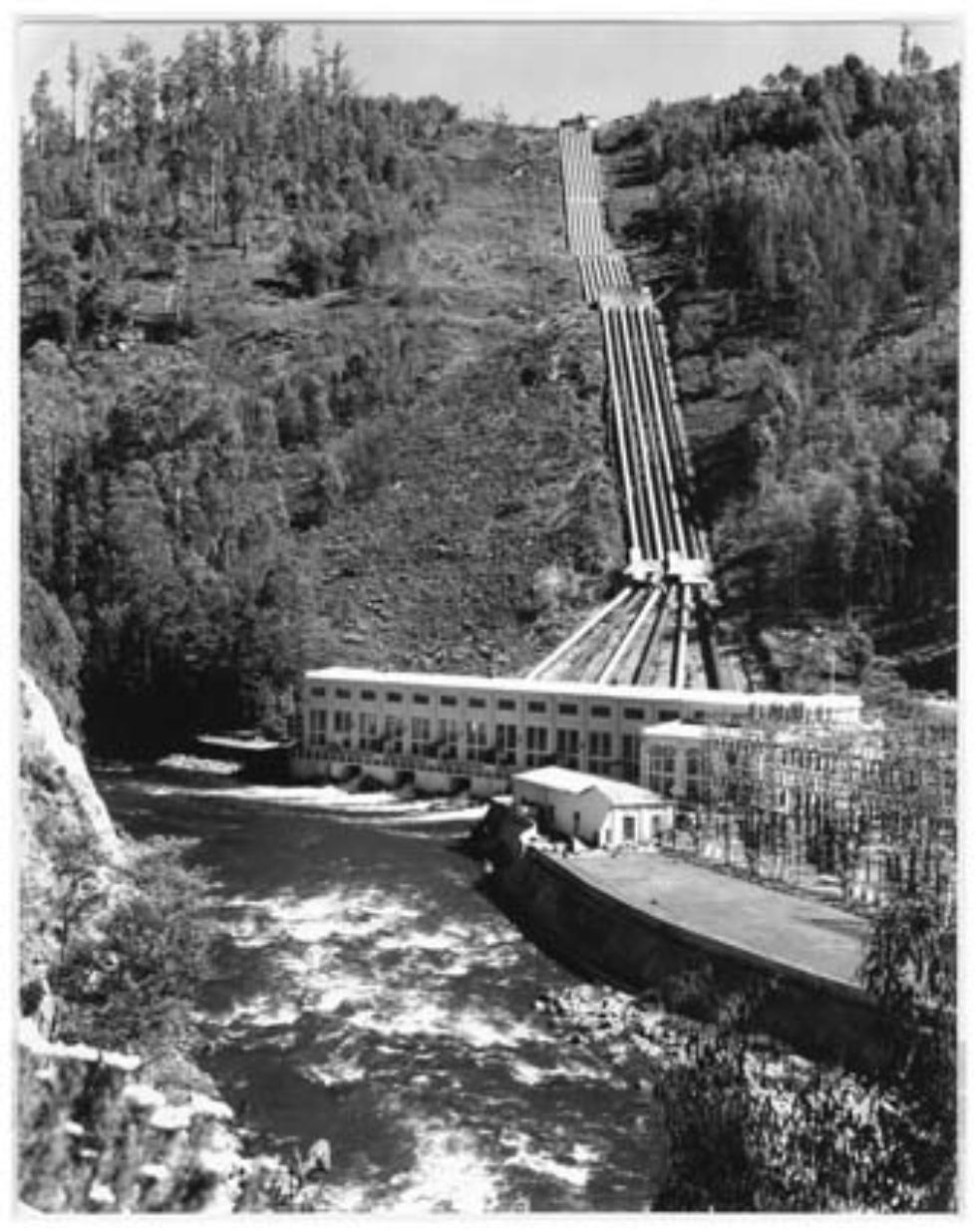 Hydro-electric Tarraleah power station adjacent to a river and descending pipeline, Tasmania. 