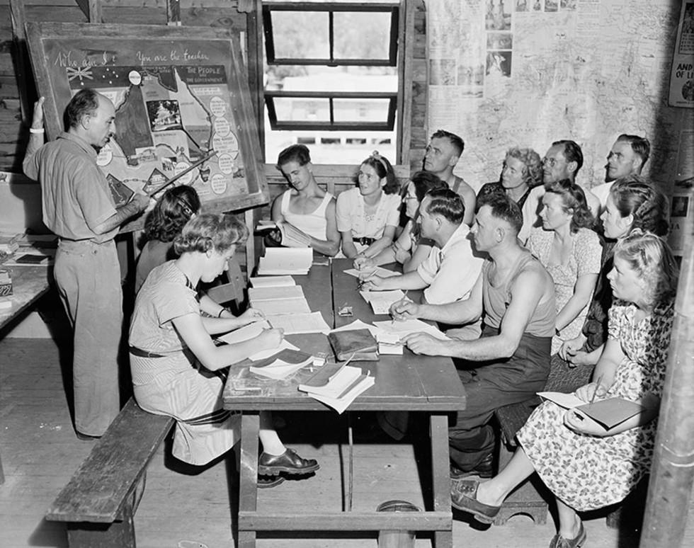 This is a photograph of migrants learning English at the Bathurst Reception Centre, New South Wales.