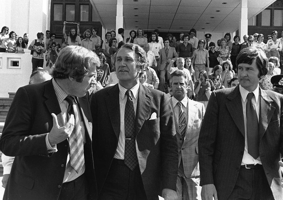 Malcolm Fraser and media outside the entrance to Provisional Parliament House.