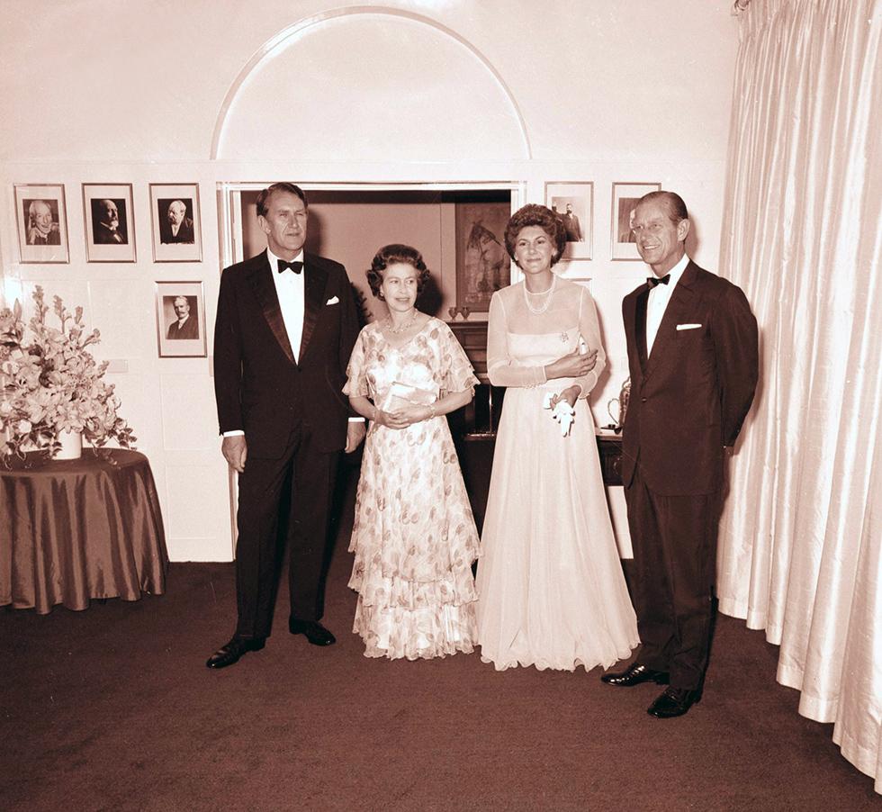 Malcolm Fraser, Queen Elizabeth, Tamie Fraser and Prince Phillip inside the lodge.