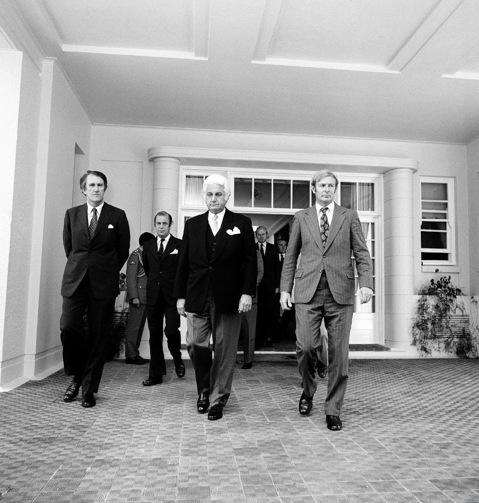 Malcolm Fraser, Governor General Sir John Kerr and Doug Anthony walking out from Government House.