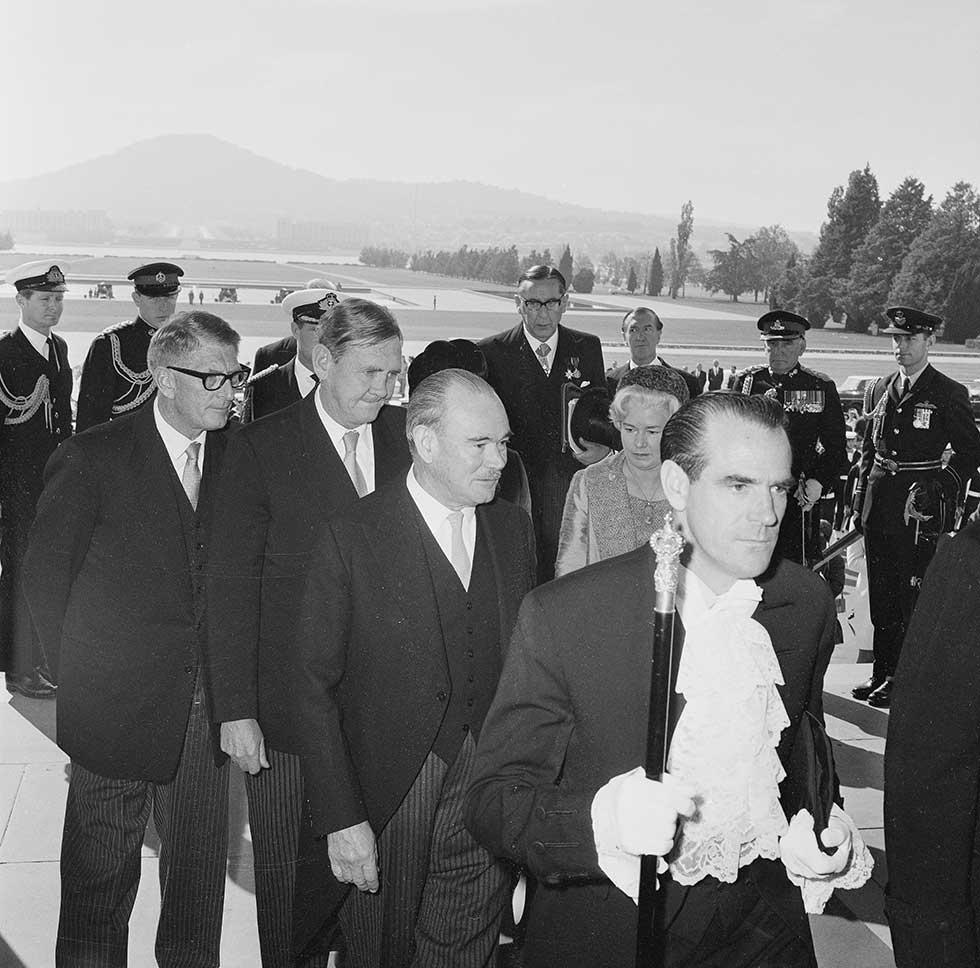 The official government party about to enter Parliament House for the swearing in of Paul Hasluck as Governor-General.