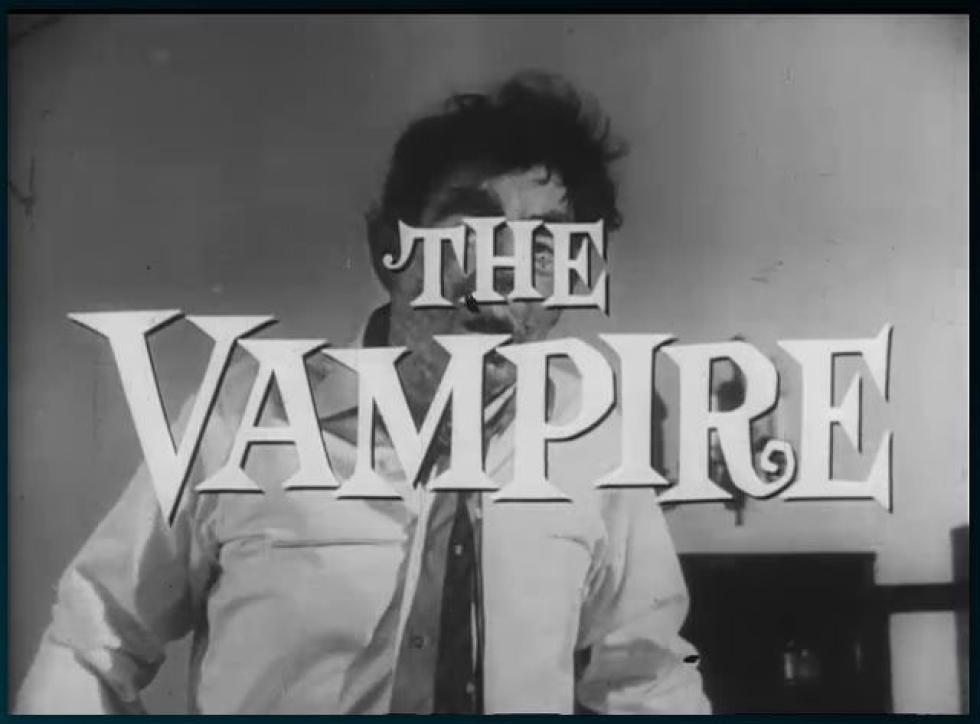 The Vampire, wearing a collared business shirt and tie.