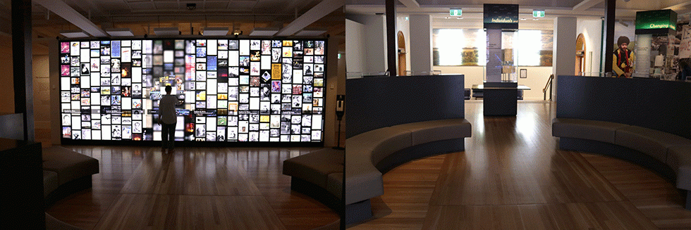 Interactive touch screen wall displaying a collage of archival images and Mura Gadi Gallery.