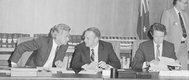 Black and white photograph: Men in suits seated at a table – Bob Hawke with his cabinet ministers.