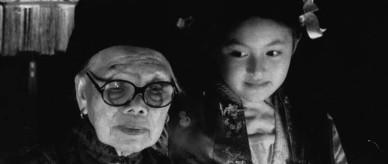 Madame Ho and her grandaughter make Chinese lanterns.