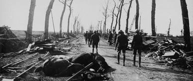 Photograph of Australian troops enlisted in World War I marching on a road in Belgium.