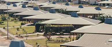 Houses with corrugtaed steel roofing.