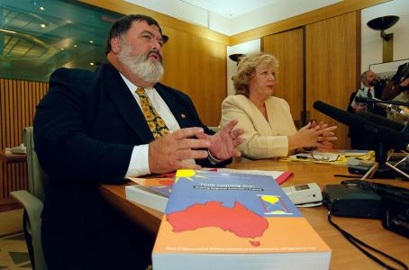 Dick Adams (Labor) and Fran Bailey (Liberal) holding a press conference seated at a table.