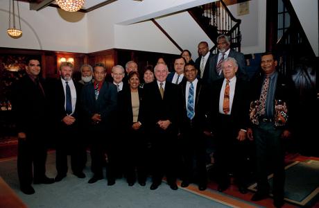 Prime Minister John Howard with members of the Aboriginal and Torres Strait Islander Commission standing by the stairs at the Lodge