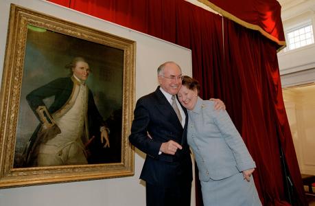 Prime Minister John Howard with his wife, Janette, next to a portrait of Captain James Cook