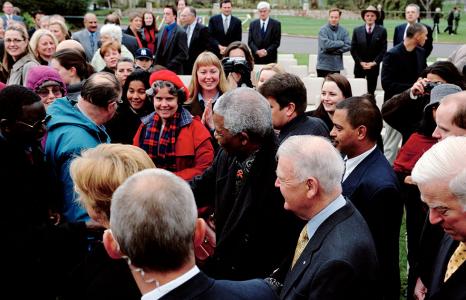 Nelson Mandela and the Governor-General Sir William Deane greeting admirers in winter attire at Government House