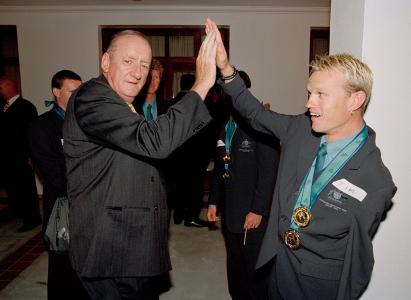 Tim Fischer high-fives sprinter Tim Matthews