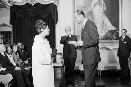 Prince Philip presents the Duke of Edinburgh Award Scheme Gold Award to Patricia Simpson, Adelaide, 1968.