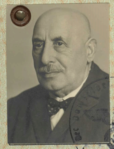 Portrait of Michael Weiss wearing suit coat with bow tie.