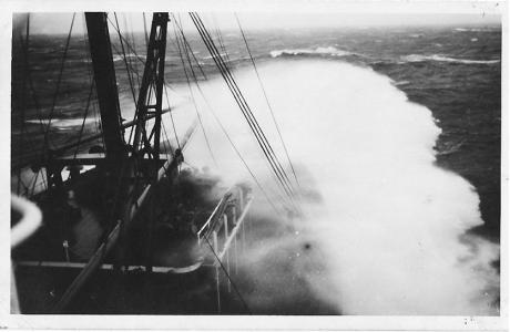 The bough of a ship cutting through waves. 