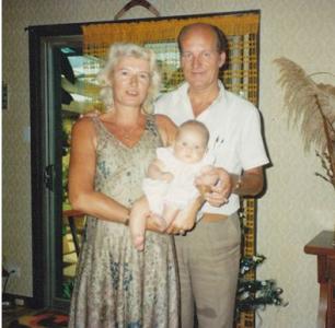 Adriana and Cornelis holding a baby.