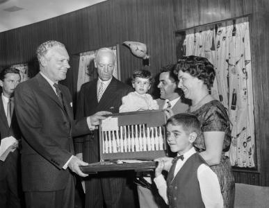 Alexander Downer presenting Antonia with a silver cutlery set.