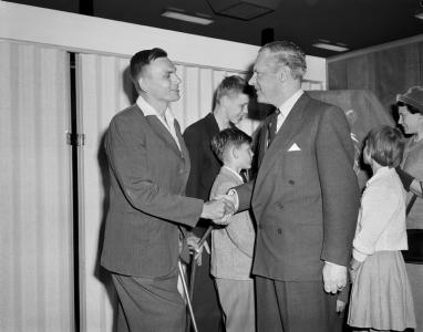 Otto Kampe shakes hands with Immigration Minister Alexander Downer.