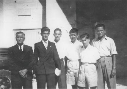 Tony with his father, friends and relatives.