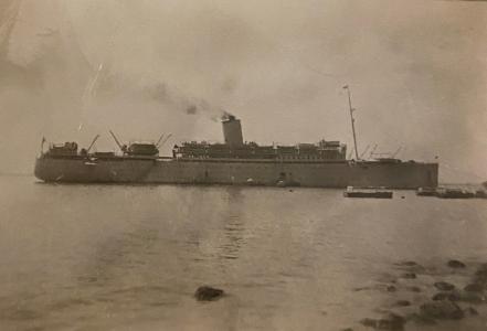 Side view of ship showing single funnel.