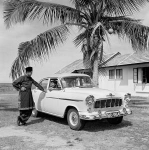 Ummi in the drivers' seat of a Holden.