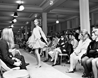 A woman modelling a dress by Jean Patou at Georges fashion store.