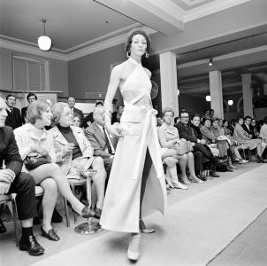 A woman modelling a dress by Jean Patou at Georges fashion store.