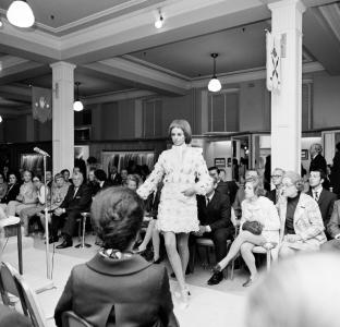 A woman modelling a dress at Georges Department Store.