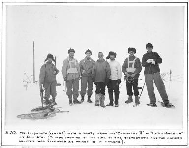 Members of the rescue party standing in the snow.