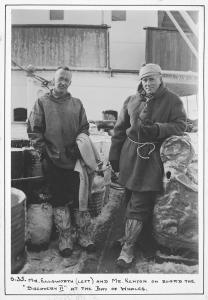 Two men on the deck of the ship Discovery II.