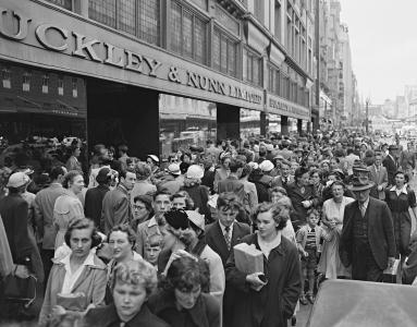 A footpath packed with pedestrians.