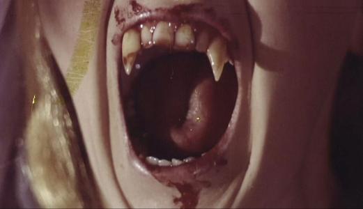 Close-up of vampire's fangs.