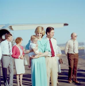 Lady Dianna holding a baby Prince William with Prince Charles after arrival in Darwin by aircraft.