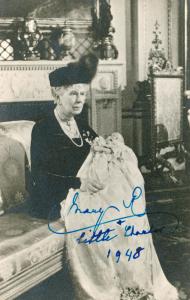 Queen Mary holding baby Prince Charles.