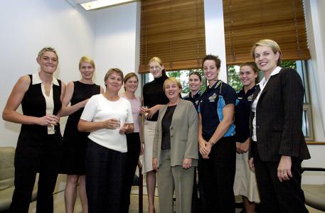 The University of Canberra Capitals basketball team standing with politicians Jenny Macklin, Tanya Plibersek, Ann Corcoran and Kate Lundy. 