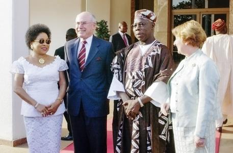 John and Janette Howard standing with Olusegun and Stella Obasanjo.