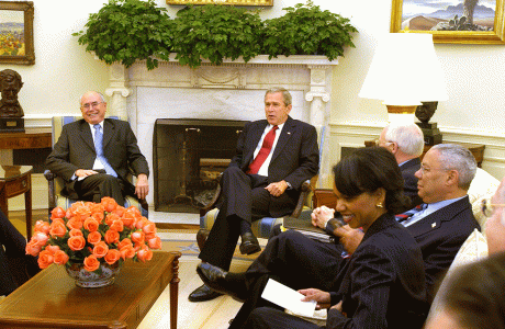 Prime Minister John Howard meets with US President George W Bush and senior members of his administration to discuss Australia–US defence and economic ties, Washington, DC, June 2004. NAA: A14482, 040270DI-072. AUSPIC photographer: Michael Jones © Commonwealth of Australia, 2004